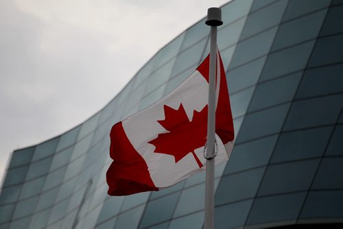 A Canadian flag blows in  the wind in front of The Canadian Museum for Human Rights after the opening ceremonies Friday.    Sept 19,  2014 Ruth Bonneville / Winnipeg Free Press