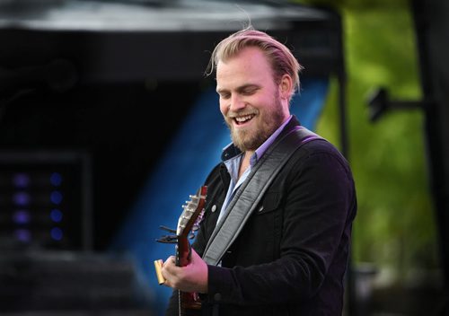 Joey Landreth, lead singer of the band The Bros Landreth, is one of the first bands to perform on the main stage at the Forks Saturday for Rights Fest due to the rain.  Crowds begin to gather to watch the bands at the main stage in the late afternoon Saturday.   Sept 20,  2014 Ruth Bonneville / Winnipeg Free Press