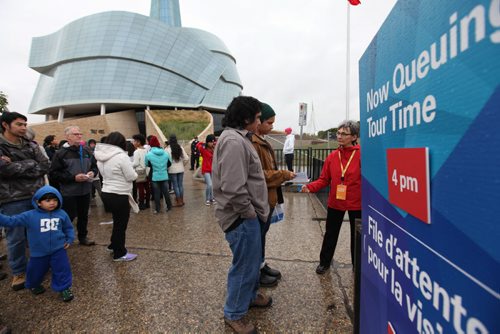 Lineups of people gather in front of the CMHR for a free tour Saturday.   Sept 20,  2014 Ruth Bonneville / Winnipeg Free Press