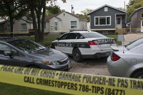 140920 Winnipeg - DAVID LIPNOWSKI / WINNIPEG FREE PRESS  The scene of a homicide on Hill Street Saturday morning. Apparently a woman was killed with an axe, and a police officer was injured as well.