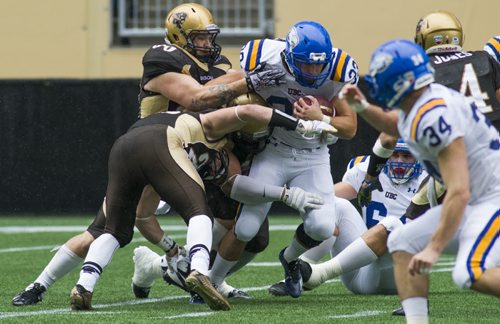 140920 Winnipeg - DAVID LIPNOWSKI / WINNIPEG FREE PRESS  Manitoba Bisons Evan Foster (#90) takes down UBC Thunderbirds Brandon Deschamps (#33) Saturday afternoon at Investors Group Field.