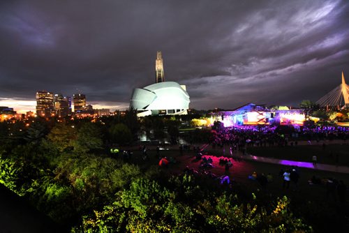 Panoramic view of Winnipeg's skyline and the main stage at the Forks during Rights Fest Saturday evening at dusk.   Sept 20,  2014 Ruth Bonneville / Winnipeg Free Press