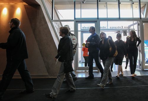 Visitors enter the front doors to the Canadian Museum for Human Rights to take in the new building and take one hour tours to four of the exhibits that are open to the public. 140921 - Sunday, September 21, 2014 -  (MIKE DEAL / WINNIPEG FREE PRESS)