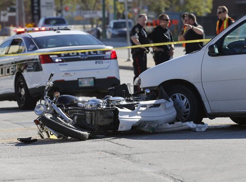 MVC  Van vs Motorcycle , Wpg police have closes a portion of Ness west bound  from St. James St. to Route 90 for a serious van vs motorcycle MVC in the intersection of Ness Ave. At Madison St that occurred around 10 am SEPT  22 2014 / KEN GIGLIOTTI / WINNIPEG FREE PRESS
