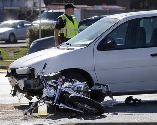 MVC  Van vs Motorcycle , Wpg police have closes a portion of Ness west bound  from St. James St. to Route 90 for a serious van vs motorcycle MVC in the intersection of Ness Ave. At Madison St that occurred around 10 am SEPT  22 2014 / KEN GIGLIOTTI / WINNIPEG FREE PRESS