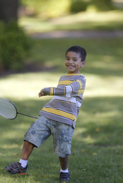 Jondrei Hangdaan,7, enjoys a game of badminton with friend Renz Danielle Gatiwan,7,  in St. John's Park Monday. Weather story.¤Wayne Glowacki/Winnipeg Free Press Sept. 22  2014