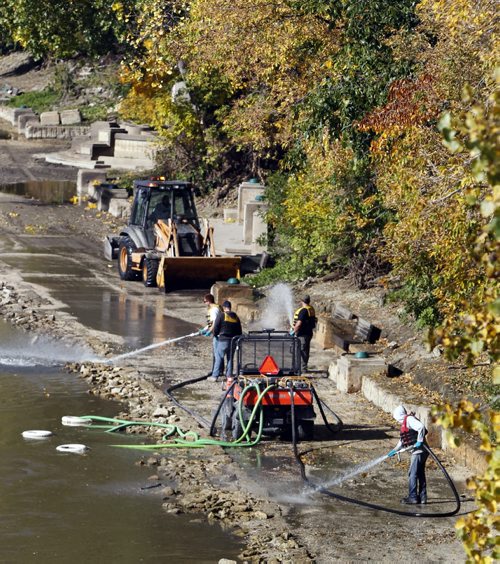 The clean up continues in autumn on the Assiniboine Riverwalk after high water levels have closed most the trail during the past spring and summer. Wayne Glowacki/Winnipeg Free Press Sept.23. 2014Wayne Glowacki/Winnipeg Free Press Sept. 23  2014