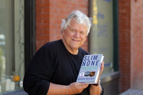 Author Howard Baldwin with his book called Slim and None. BORIS MINKEVICH / WINNIPEG FREE PRESS  Sept. 23, 2014