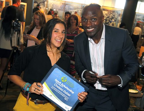 Chelsea Dubiel is stoked about getting to meet Milt Stegall at the Manitoba Student Athletes & Coaches Awarded event. The event was held at the Manitoba Sport Federation and awarded $25,000 in Scholarships.  BORIS MINKEVICH / WINNIPEG FREE PRESS  Sept. 23, 2014