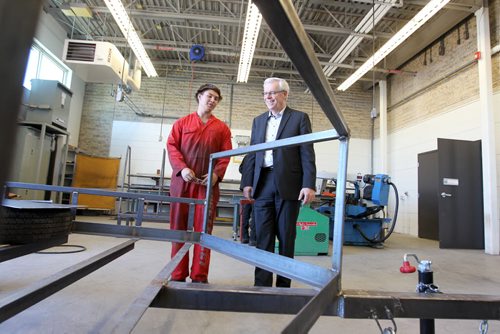 Grade 12 welding student  Alex Bordessa chats with Premier Greg Selinger in the new welding  facility in the Steinbach Regional Secondary School as it celebrates its Grand Opening of Tuesday.  Sept 23,  2014 Ruth Bonneville / Winnipeg Free Press