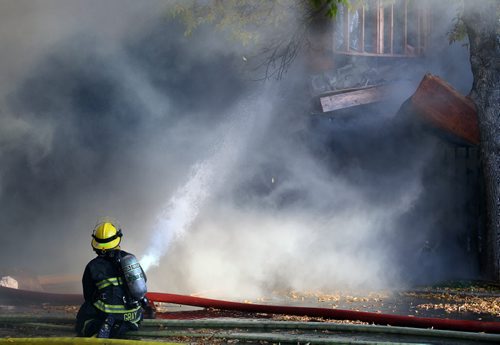 City firefighters battle a blaze at 27 Apple Lane after an explosion sent one man to hopital in critical condition. See Ashley Prest story. September 23, 2014 - (Phil Hossack / Winnipeg Free Press)