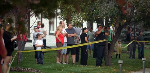 Neighbors watch as City firefighters battle a blaze at 27 Apple Lane after an explosion sent one man to hospital in critical condition.  See Ashley Prest story. September 23, 2014 - (Phil Hossack / Winnipeg Free Press)