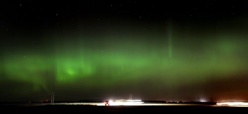 Aurora Borealis flow in the night sky over a harvest in full swing near Sanford Tuesday evening. STAND UP - September 23, 2014 - (Phil Hossack / Winnipeg Free Press)
