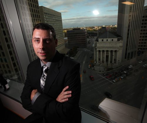 Christopher J. Gunning, Manitoba's new U.S. Consul poses in his new quarters over Portage and Main. See release. September 24, 2014 - (Phil Hossack / Winipeg Free Press)