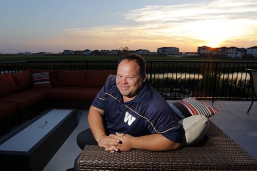 49.8 FEATURE - Wade Miller. Wade poses for a snap on his deck at his home in south Winnipeg.  BORIS MINKEVICH / WINNIPEG FREE PRESS  Sept. 24, 2014