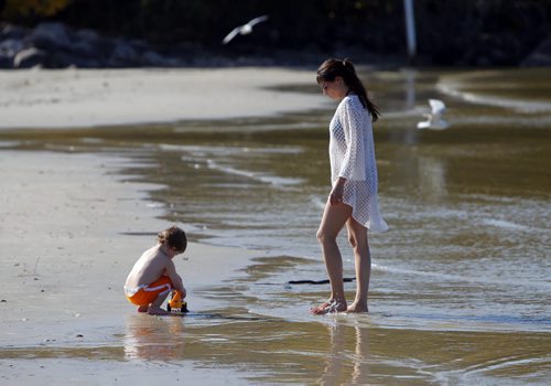 Lucik Brisebois,2, at Grand Beach with his mom Nichole Brisebois. A little bit of summer delivered to Manitobans in late September.  BORIS MINKEVICH / WINNIPEG FREE PRESS  Sept. 25, 2014