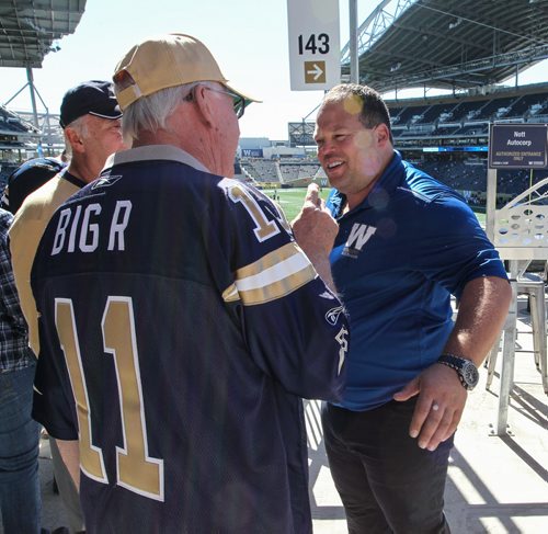 Wade Miller, president and CEO of the Winnipeg Blue Bombers takes time to work the crowds before the Banjo Bowl game at Investors Group Field. 140907 - Friday, September 26, 2014 -  (MIKE DEAL / WINNIPEG FREE PRESS)