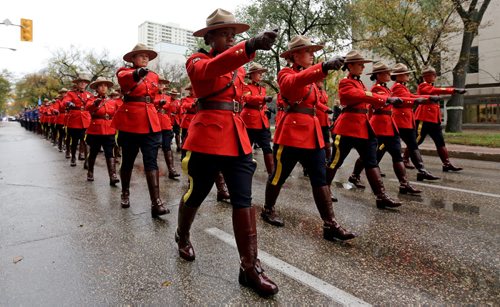 RCMP and other Police officers march down Broadway towards the Legislative Building, Sunday, September 28, 2014. (TREVOR HAGAN/WINNIPEG FREE PRESS)