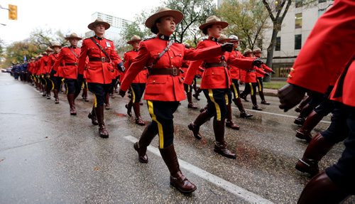 RCMP and other Police officers march down Broadway towards the Legislative Building, Sunday, September 28, 2014. (TREVOR HAGAN/WINNIPEG FREE PRESS)