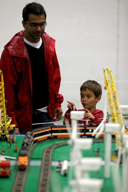Michael Workman, and his son, Joseph, 4, enjoying the massive Lego train display at the Manitoba Mega Train Show at the Canlan Sports Centre, Sunday, September 28, 2014. The show is on until 5pm. (TREVOR HAGAN/WINNIPEG FREE PRESS)