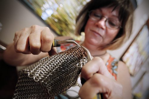 September 28, 2014 - 140928  -  Artist Wendy Seversen works on a chain mail purse made of 12000 stainless and bronze rings as part of Culture Days at The Forks Sunday, September 28, 2014. Seversen has been an artist and practising her craft for 10 years. She also creates jewelry and glass pieces. John Woods / Winnipeg Free Press