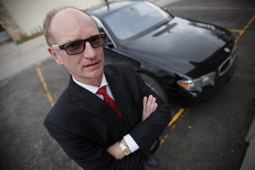 September 28, 2014 - 140928  -  Paul Edmond is photographed beside his gas guzzling BMW Sunday, September 28, 2014. Edmond wants to buy an electric car and wishes Manitoba Hydro would offer rebates and infrastructure. John Woods / Winnipeg Free Press