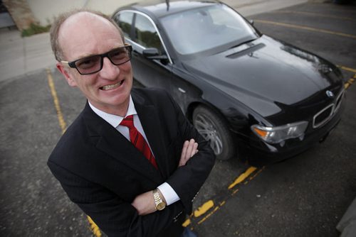 September 28, 2014 - 140928  -  Paul Edmond is photographed beside his gas guzzling BMW Sunday, September 28, 2014. Edmond wants to buy an electric car and wishes Manitoba Hydro would offer rebates and infrastructure. John Woods / Winnipeg Free Press