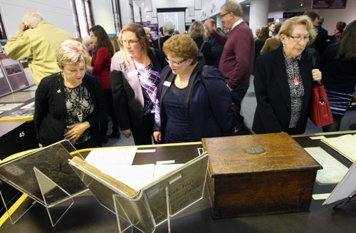 People look at artifacts  at The Archives of Manitoba,- where today was the 40th anniversary of the transfer of the Hudsons Bay Company archives and artifact collections from London, England to Winnipeg, and the 20th anniversary of their gift to the Province of Manitoba.-See Murray McNeil story- Sept 30, 2014   (JOE BRYKSA / WINNIPEG FREE PRESS)
