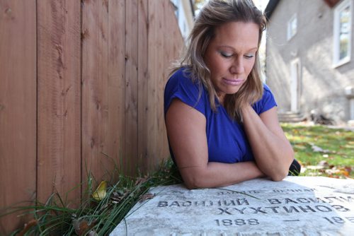 Charlotte Dubois wants to have headstone that was put into the yard of her building returned to its rightful place.  See Adam Wazny's story.    Sept 30,  2014 Ruth Bonneville / Winnipeg Free Press