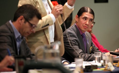 Robert-Falcon Ouellette, listens to the other candidates at a Mayoral Forum Wednesday evening on Wellington Crescent. See story. Sept, 30, 2014 - (Phil Hossack / Winnipeg Free Press)