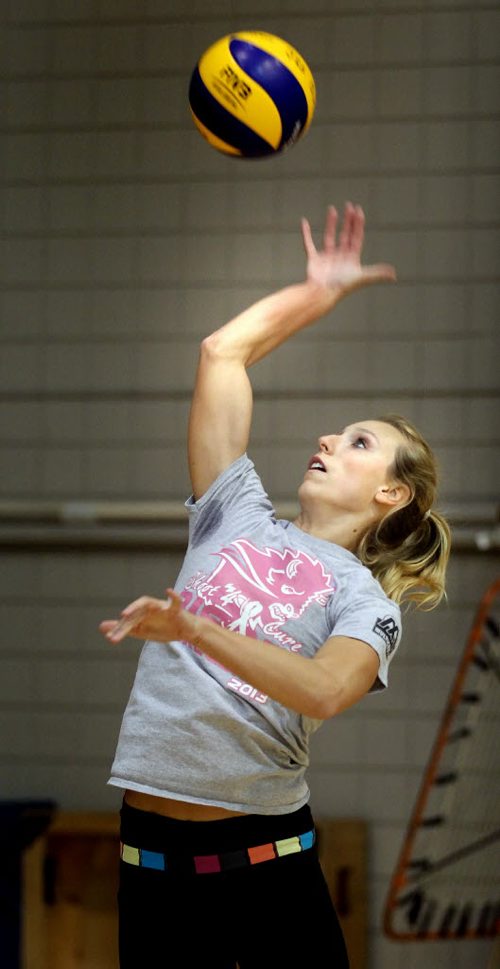 Rachel Cockrell goes up for a spike at a team workout Wednesday afternoon at the U of M's Investors Group Athletic Centre. See story. October 30, 2014 - (Phil Hossack / Winnipeg Free Press) University of Manitoba bison women's volleyball