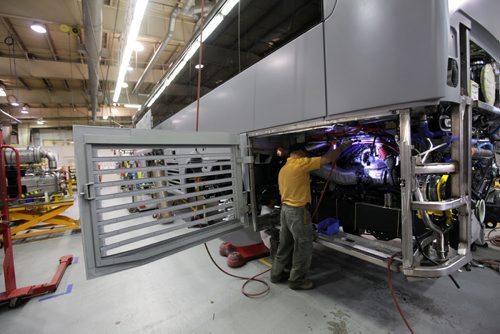 Workers at Motor Coach Industries work on building and putting the finishing touches on motor coaches at their plant on Clarence Ave. in Winnipeg.  The company recently completed its 7,000th coach.    See Martin Cash MCI story.  Oct 01,  2014 Ruth Bonneville / Winnipeg Free Press