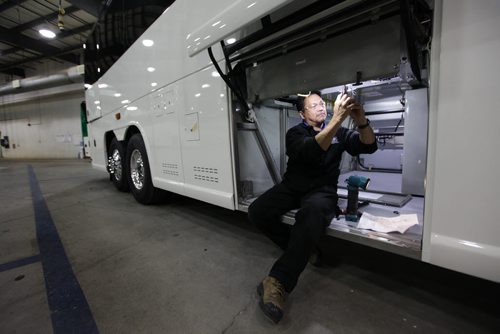 Workers at Motor Coach Industries work on building and putting the finishing touches on motor coaches at their plant on Clarence Ave. in Winnipeg.  The company recently completed its 7,000th coach.    See Martin Cash MCI story.  Oct 01,  2014 Ruth Bonneville / Winnipeg Free Press