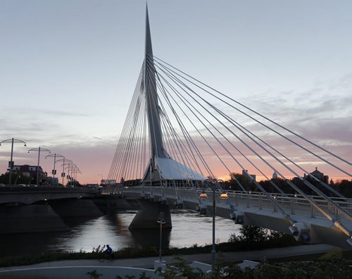 Stdup . It was a clear sunrise over the Esplanade Riel  with a sunny high of 18 expected   Oct. 2 2014 / KEN GIGLIOTTI / WINNIPEG FREE PRESS
