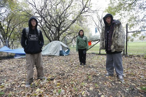 LOCAL -Proresters set up camp near CMHR in Stephen Juba Park ,LtoR  Chris Naeyen Jasmin Hobson and Corry Bruce , all were in CFS care as youths , they are protesting the falling between the cracks  of missing women as well as  children in CFS care . They paln to camp out for  a month . LOCAL . A group of youth calling themselves United Youth Protests  have camped out in Stephen Juba Park protesting  the youth who have fallen through the cracks of CFS as well as missing women and children in the province , they plan to camp out for the next month . #Youth Have a Voice Facebook .com/youth have a voice .  Oct. 3 2014 / KEN GIGLIOTTI / WINNIPEG FREE PRESS