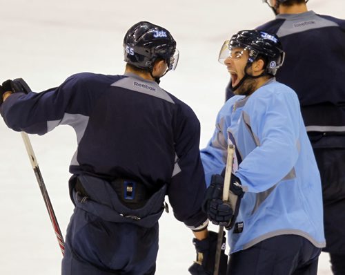 Jets practice at MTS Centre. #58 ERIC O'DELL, right, and   #55 MARK SCHEIFELE horse around in practice. BORIS MINKEVICH / WINNIPEG FREE PRESS  Oct. 3, 2014