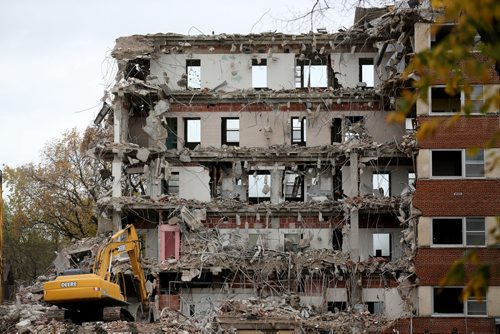A demolition crew taking down a large building on Arlington Street between Preston and Westminster Avenue, Friday, October 3, 2014. (TREVOR HAGAN/WINNIPEG FREE PRESS)