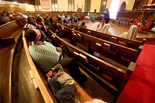 Afaf Abodigin and her son Isaiah,4, at Knox United Church during a "Call for Prayer" for the Ebola crisis in West Africa, Friday, October 3, 2014. (TREVOR HAGAN/WINNIPEG FREE PRESS)