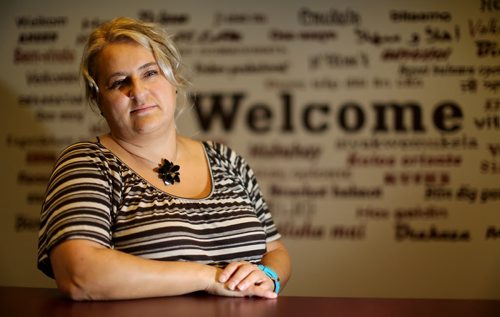 Senada Murtic-Hrncic, a former elemnetary school teacher from Bosnia-Herzegovina, at the Family Dynamics non-profit agency for newcomers, Saturday, October 4, 2014. (TREVOR HAGAN/WINNIPEG FREE PRESS)