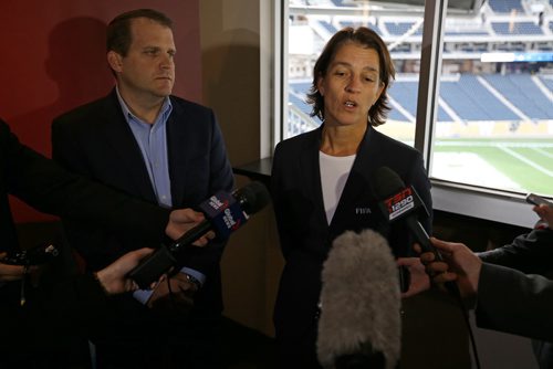 Don Hardman, National Organizing Committee Chief Stadia Officer and Tatjana Haenni, FIFA's Head of Women's Competitions, answering questions at Investors Group Field, Saturday, October 4, 2014. (TREVOR HAGAN/WINNIPEG FREE PRESS)
