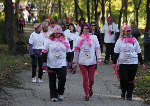 Participants in the Run for the Cure head up the walking path along Waterfront Drive, Sunday, October 5, 2014. (TREVOR HAGAN/WINNIPEG FREE PRESS)