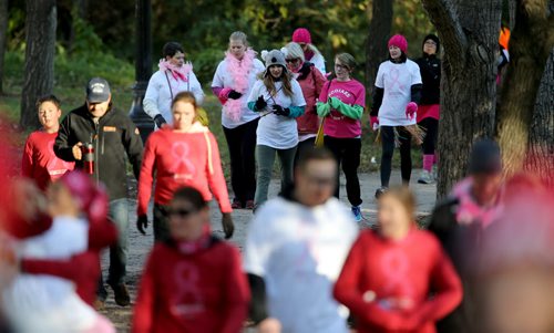 Participants in the Run for the Cure head up the walking path along Waterfront Drive, Sunday, October 5, 2014. (TREVOR HAGAN/WINNIPEG FREE PRESS)