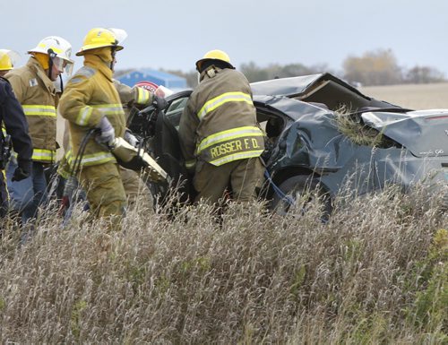 Members of the R.M. of Rosser Fire Dept. had to use the jaws of life at the scene of a rollover on Sturgeon Rd. near Mollard Rd. Monday morning that sent one to the hospital.  Wayne Glowacki/Winnipeg Free Press Oct. 6 2014