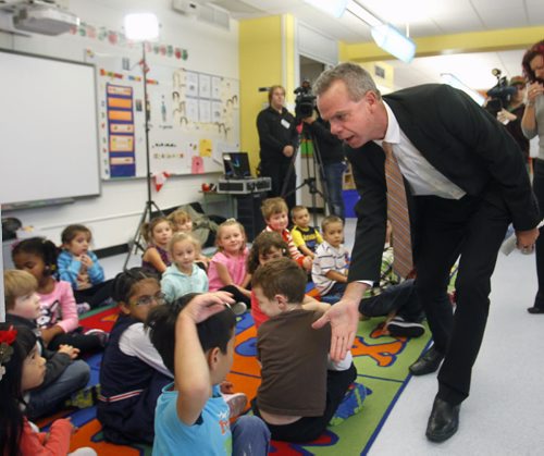Education and Advanced Learning Minister James Allum gets five from students in the new kindergarten classroom in École Robert Browning School Monday made possible through the province's smaller classes initiative announced the Manitoba Gov't in partnership with school divisions has hired over 100 new teachers this year bringing the total to 315.   Bruce Owen story.  Wayne Glowacki/Winnipeg Free Press Oct. 6 2014