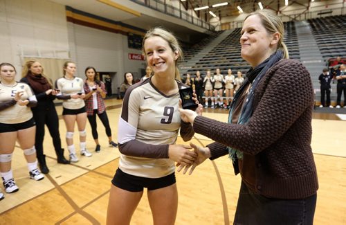 Bisons' Tram Captain, Brittany Habing is presented with a necklace commemorating the teams CIS championship season last year prior to the game against the Calgary Dino's at the University of Manitoba, Thursday, October 9, 2014. Presenting necklace is Sarah Teetzel. Associate dean kinesiology and recreation management. (TREVOR HAGAN/WINNIPEG FREE PRESS)