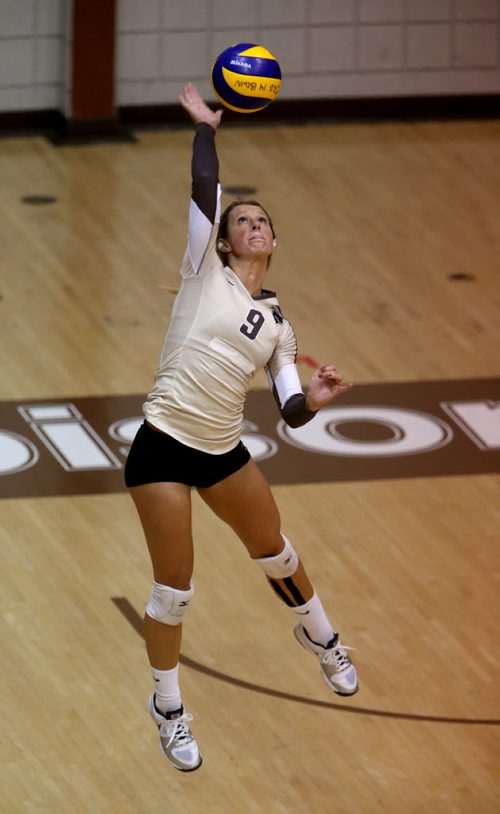 University of Manitoba Bisons' Brittany Habing serves the ball during their game against the Calgary Dinos at Investors Group Athletic Centre, Thursday, October 9, 2014. (TREVOR HAGAN/WINNIPEG FREE PRESS)