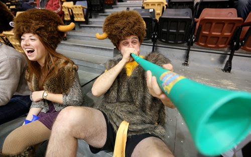 Rebecca Kunzman and Dave Grad cheer for the University of Manitoba Bisons' womens volleyball team during their game against the Calgary Dinos at Investors Group Athletic Centre, Thursday, October 9, 2014. (TREVOR HAGAN/WINNIPEG FREE PRESS)