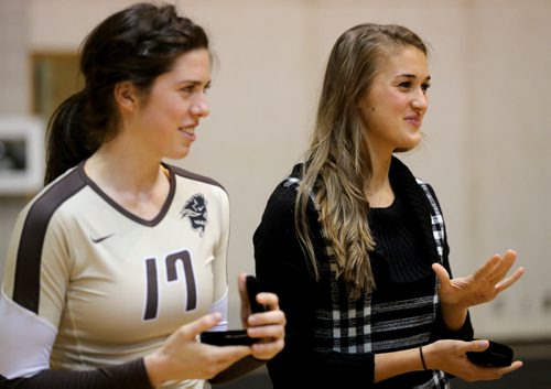 University of Manitoba Bisons' Sarah Klassen, and former player Taylor Pischke both members of the 2013/14 CIS championship winning and the rest of the team were honoured prior to the teams game against the Calgary Dinos at Investors Group Athletic Centre, Thursday, October 9, 2014. (TREVOR HAGAN/WINNIPEG FREE PRESS)