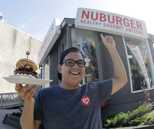 Ivan Valencia, G.M. and part owner of Nuburger on Stradbrook Ave. with a Shang-Awesome beef burger. Story about this burger joint that changed its name to unconfuse some customers. It sells beef, chicken and bison burgers (and veggie burgers) but it's not a vegan restaurant. Geoff Kirbyson  story. Wayne Glowacki/Winnipeg Free Press Oct. 10 2014