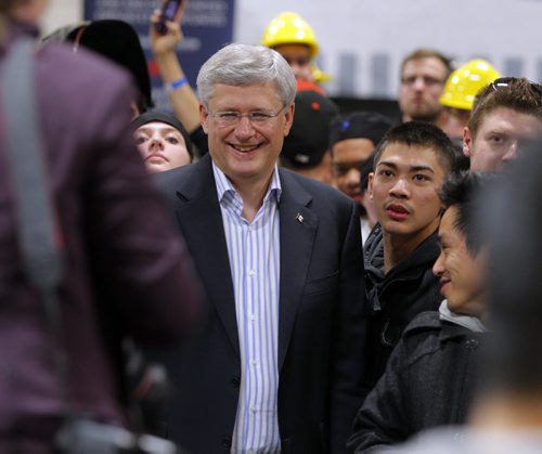 Prime Minister Stephen Harper at photo opportunity at Manitoba Institute of Trades and Technology  Henlow Campus, 130 Henlow Bay. He gets photo taken in the crowd. BORIS MINKEVICH / WINNIPEG FREE PRESS October 10, 2014
